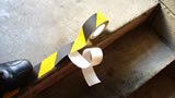 Press down the Anti-Slip Tape in place with a hand roller or foot